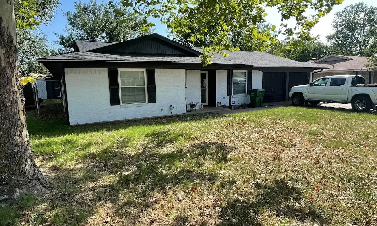 Professional roofing crew working on a residential roof in Jonesboro